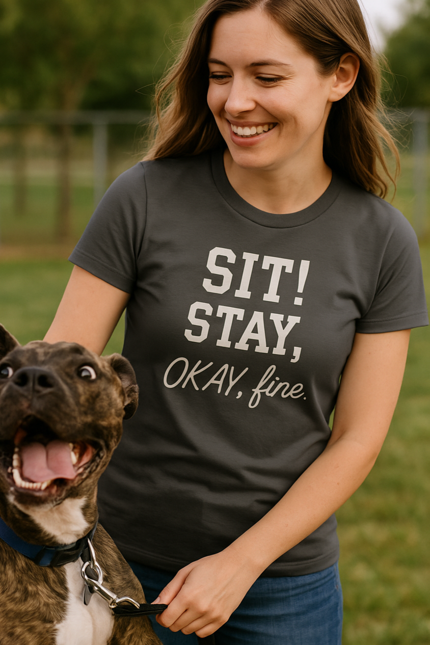 Funny dog obedience command t-shirt for women that says "SIT! STAY, OKAY, fine." on a fitted asphalt Bella+Canvas 6004 shirt. Sarcastic dog mom tee with playful typography.