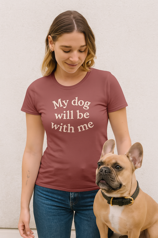 Woman wearing a t-shirt with 'My dog will be with me' text, standing next to a dog.